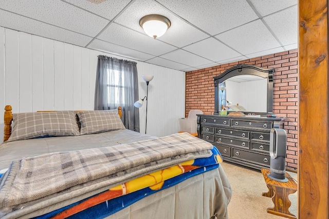 bedroom featuring carpet and a paneled ceiling