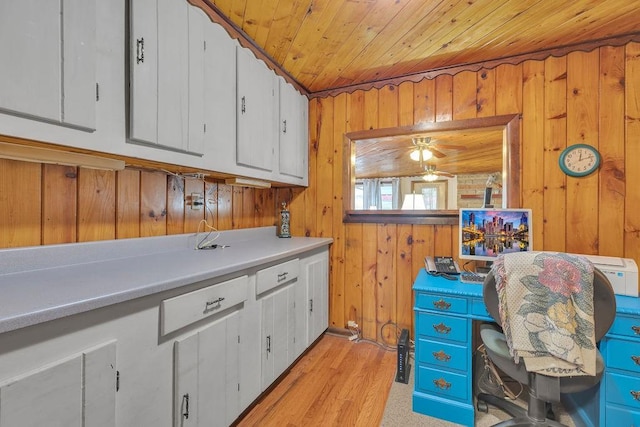 laundry area with wooden ceiling and wood walls