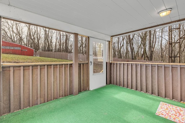 unfurnished sunroom with plenty of natural light