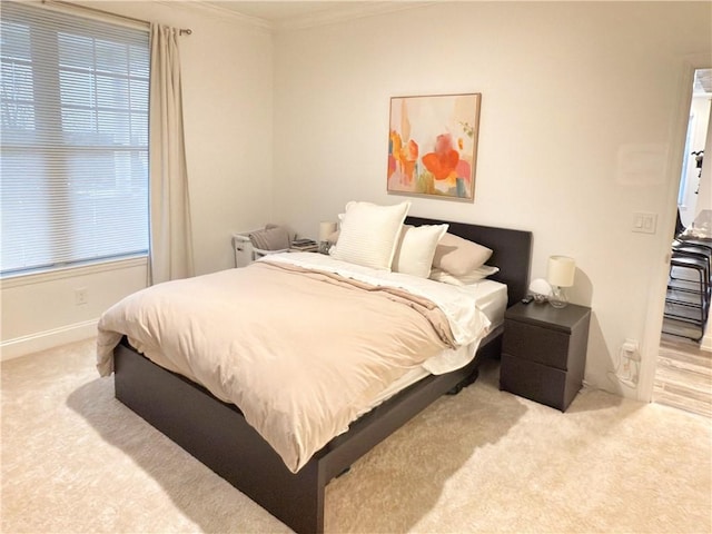 carpeted bedroom with crown molding