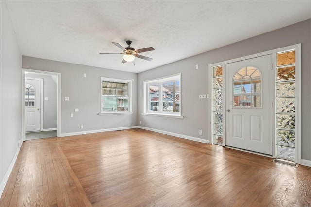 foyer entrance featuring hardwood / wood-style floors, a textured ceiling, and ceiling fan