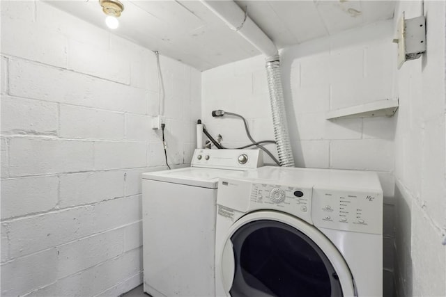 laundry area featuring washing machine and clothes dryer