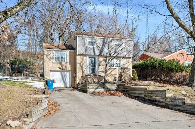 rear view of house with a garage