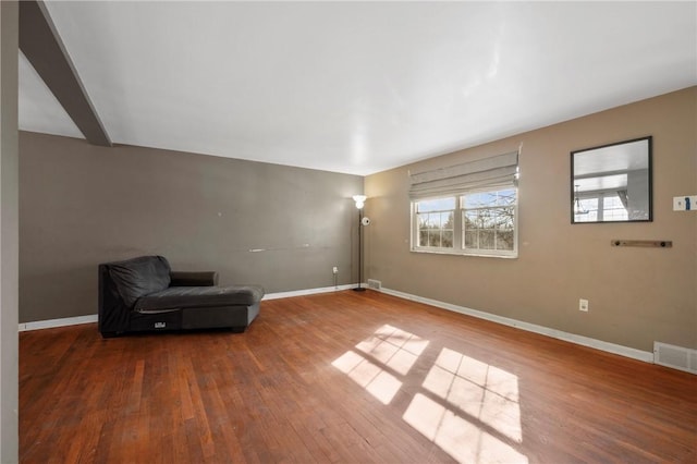 unfurnished room with hardwood / wood-style flooring