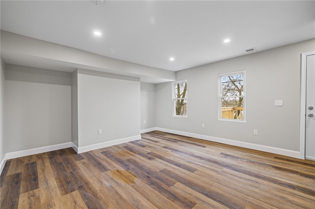 basement featuring dark hardwood / wood-style floors