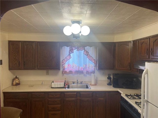 kitchen featuring sink and white appliances