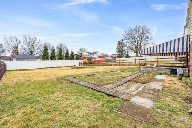 view of yard with central AC