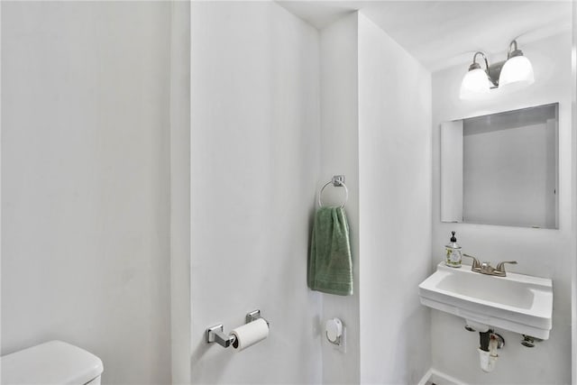 bathroom with toilet and sink