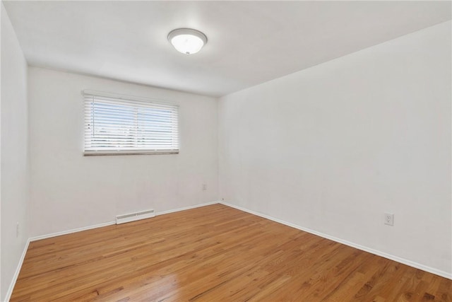 empty room featuring hardwood / wood-style flooring