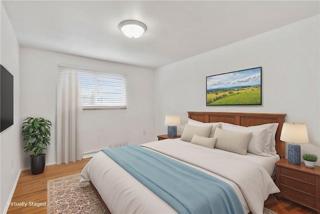 bedroom featuring hardwood / wood-style flooring