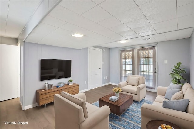 living room with dark hardwood / wood-style flooring