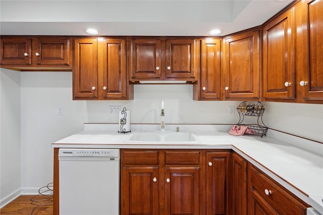 kitchen featuring white dishwasher and sink