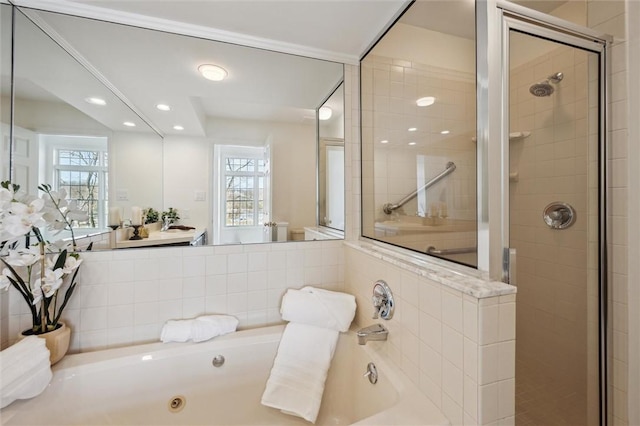 bathroom featuring shower with separate bathtub