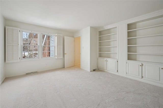 interior space featuring light colored carpet