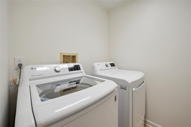 laundry area with washing machine and dryer