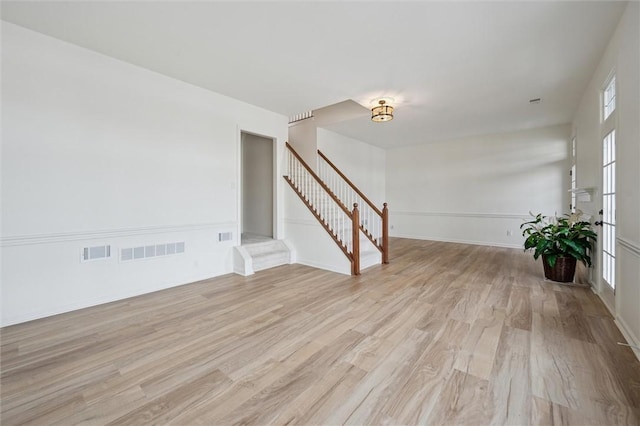 unfurnished room with light hardwood / wood-style floors