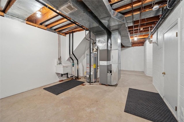 basement with gas water heater, sink, and heating unit