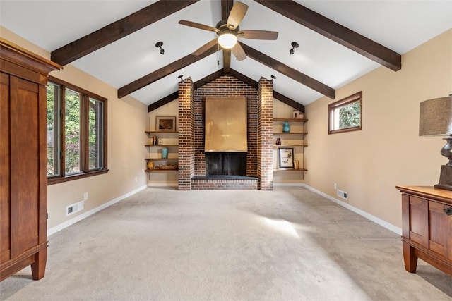 unfurnished living room featuring lofted ceiling with beams, a brick fireplace, light colored carpet, and ceiling fan