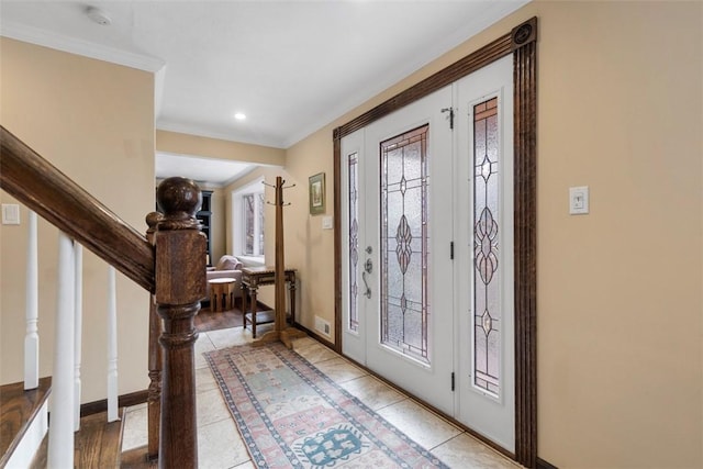 foyer featuring crown molding