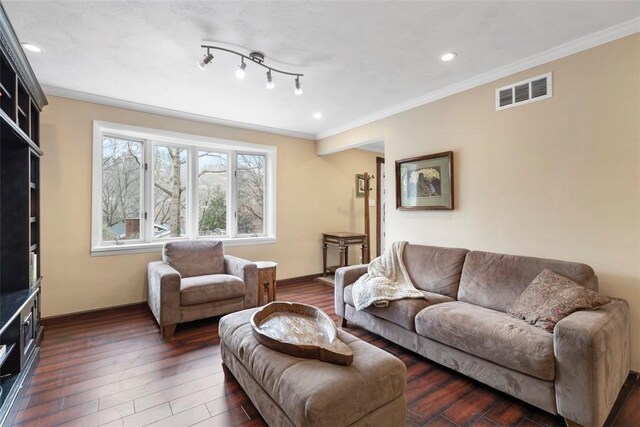 living room featuring crown molding and dark hardwood / wood-style flooring