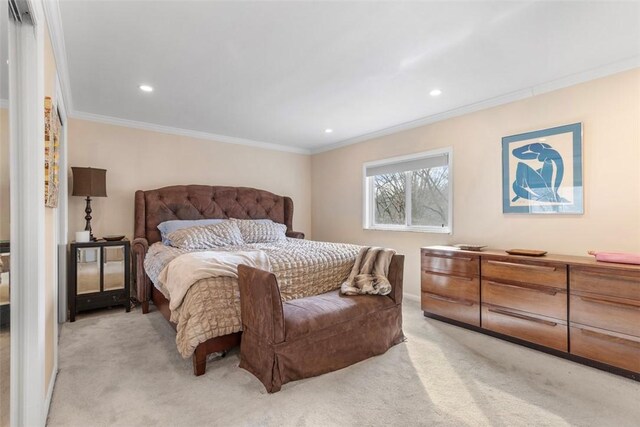 carpeted bedroom with ornamental molding