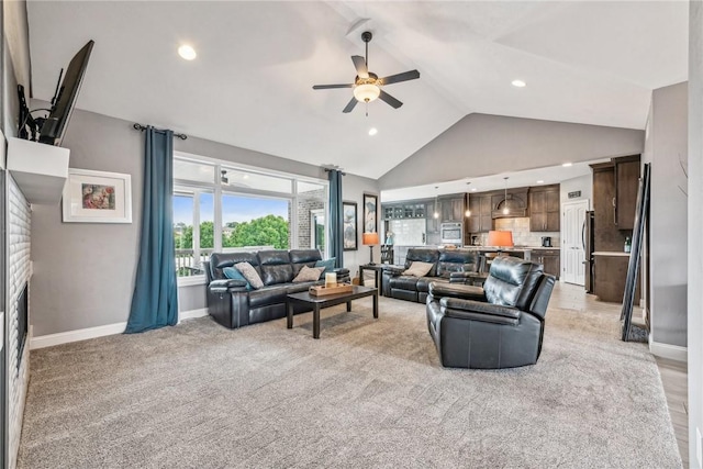 living room with light carpet, high vaulted ceiling, and ceiling fan