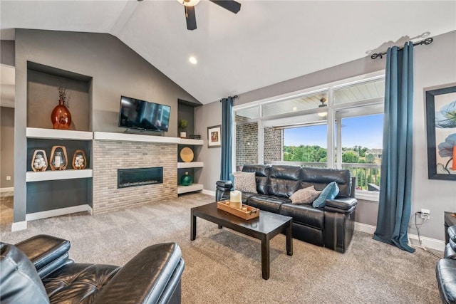 living room featuring vaulted ceiling, built in features, a fireplace, carpet floors, and ceiling fan