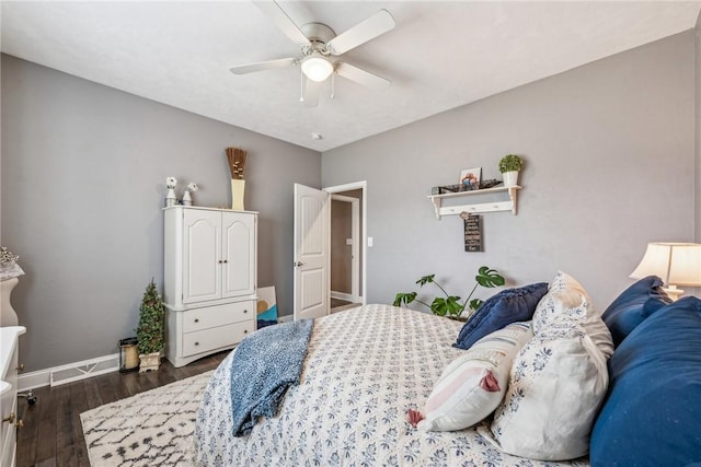 bedroom with dark wood-type flooring and ceiling fan