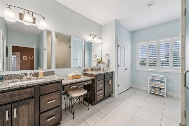 bathroom with tile patterned flooring and vanity