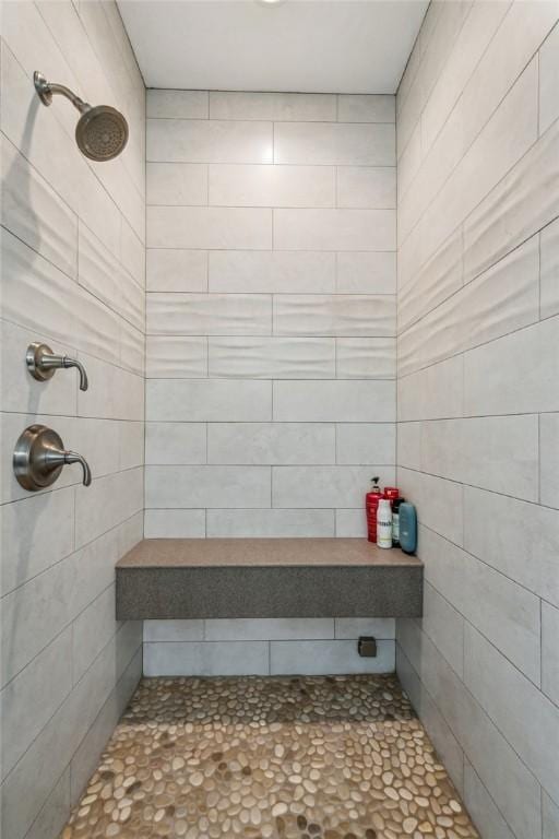 bathroom with tiled shower