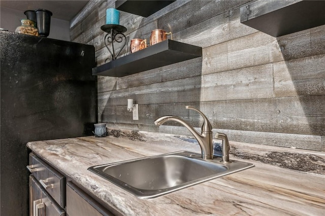 kitchen with black fridge and sink