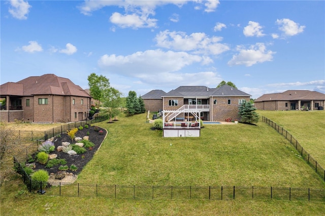 rear view of property with a patio and a yard