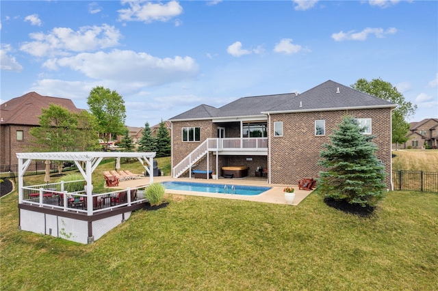 rear view of property with a fenced in pool, a patio, a lawn, and a pergola