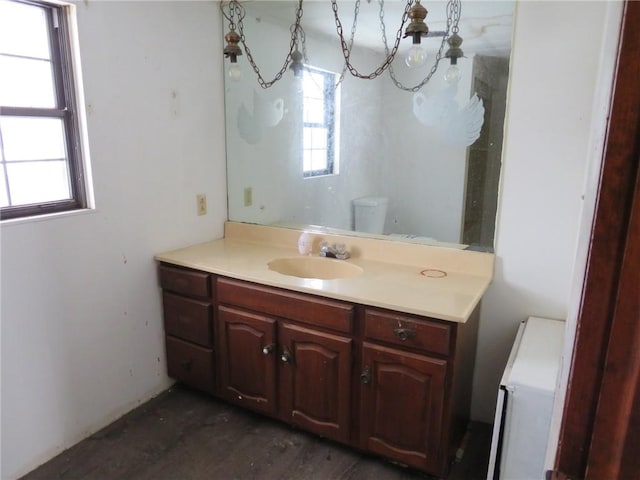 bathroom featuring vanity and toilet