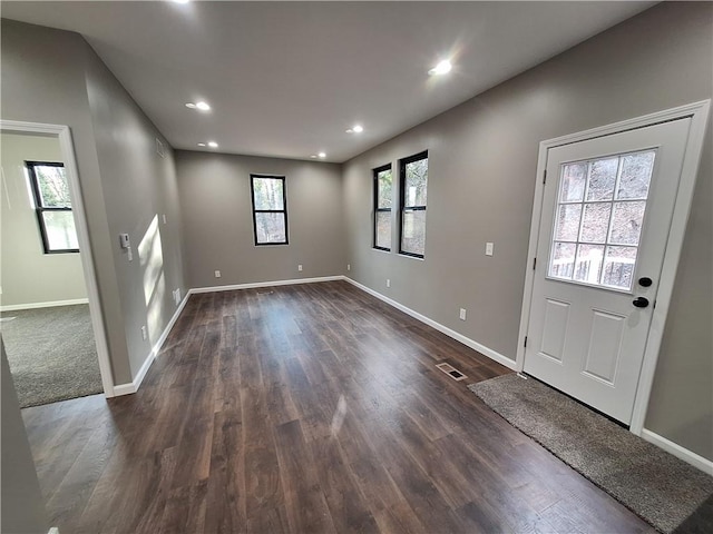 entrance foyer featuring dark hardwood / wood-style floors