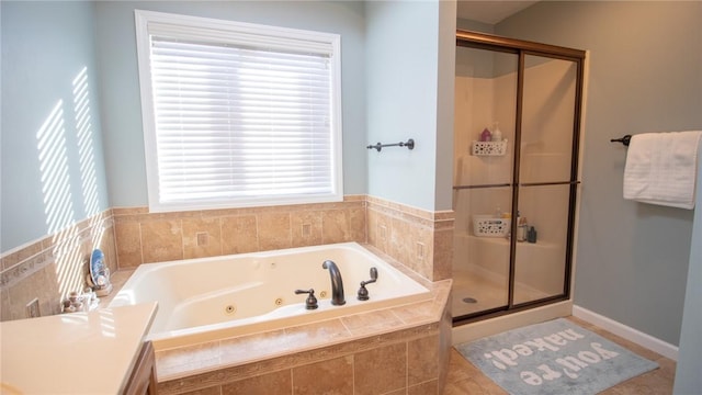 bathroom with shower with separate bathtub