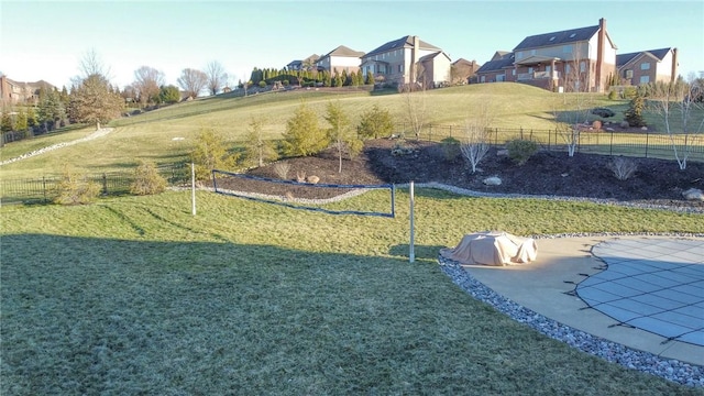 surrounding community with a yard and a patio area