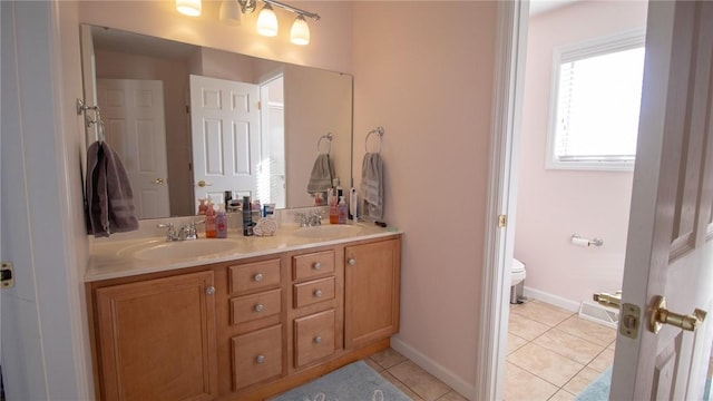 bathroom with vanity, tile patterned floors, and toilet