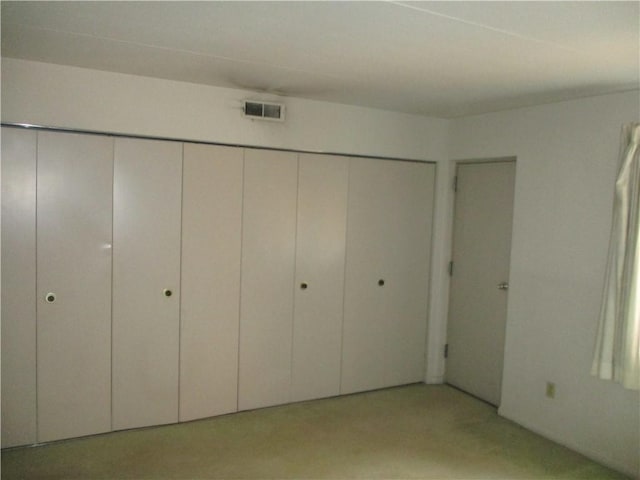 unfurnished bedroom featuring a closet