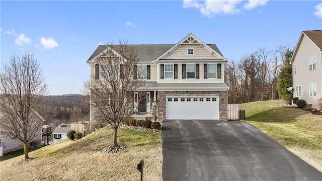 view of front of property featuring a garage and a front yard