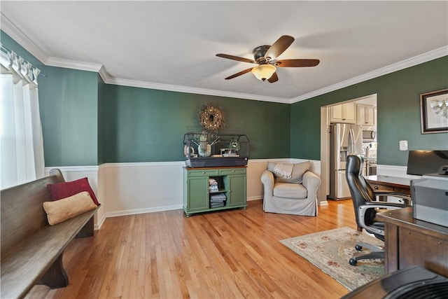 office area featuring crown molding, light hardwood / wood-style floors, and ceiling fan