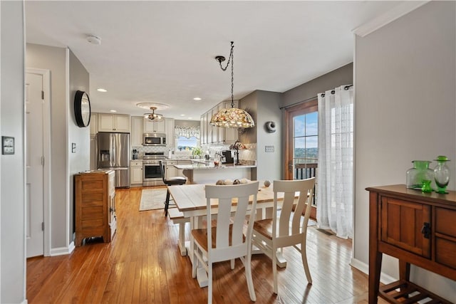 dining area with light wood-type flooring