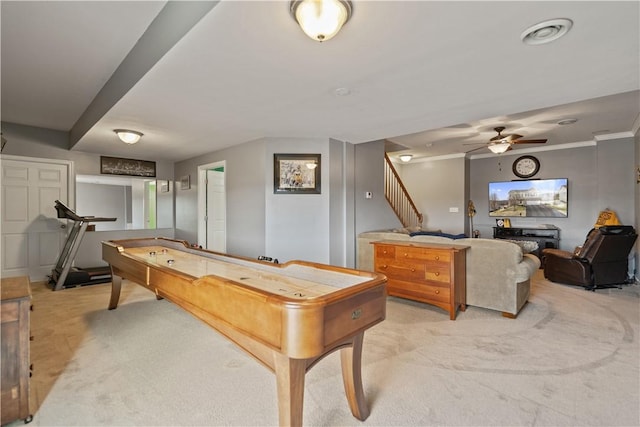 playroom with crown molding, ceiling fan, and light carpet