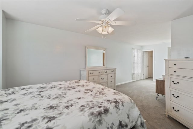 bedroom with ceiling fan and dark colored carpet