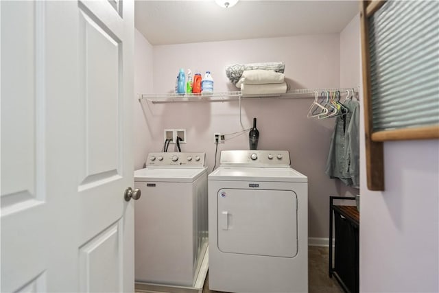 washroom featuring washer and clothes dryer