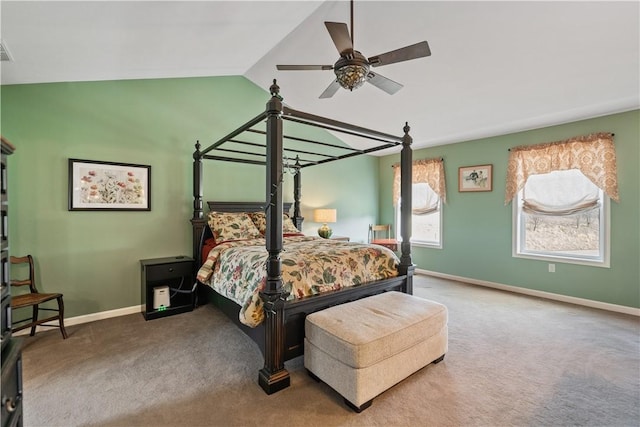 carpeted bedroom featuring ceiling fan and vaulted ceiling