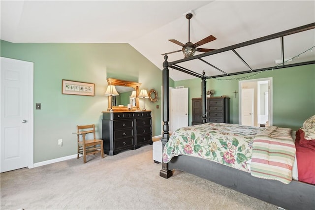 bedroom featuring vaulted ceiling, light carpet, and ceiling fan