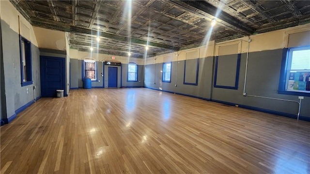 unfurnished room featuring hardwood / wood-style flooring