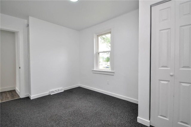 1036 7th St, West Elizabeth, PA 15088 - unfurnished bedroom with baseboards and dark colored carpet