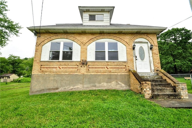 1036 7th St, West Elizabeth, PA 15088 - view of front of house featuring brick siding and a front yard